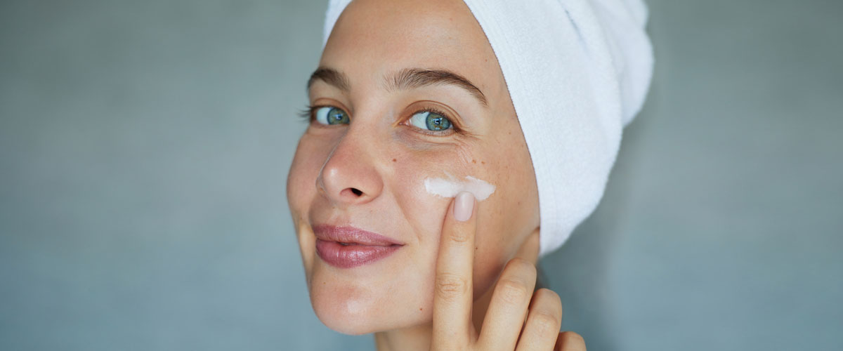 women cleansing her face